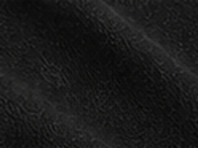 Washed-black garment-dyed cotton jersey close-up