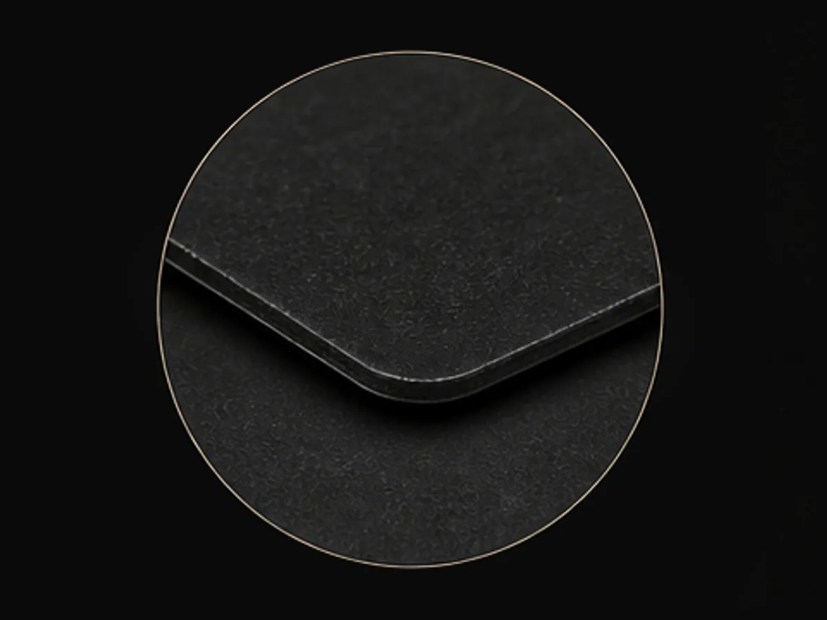Close-up of the matte laminate edge on a black sticker